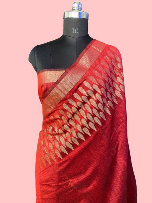 Red maroon pure silk saree with gold edge and diagonal patterned pallu on mannequin