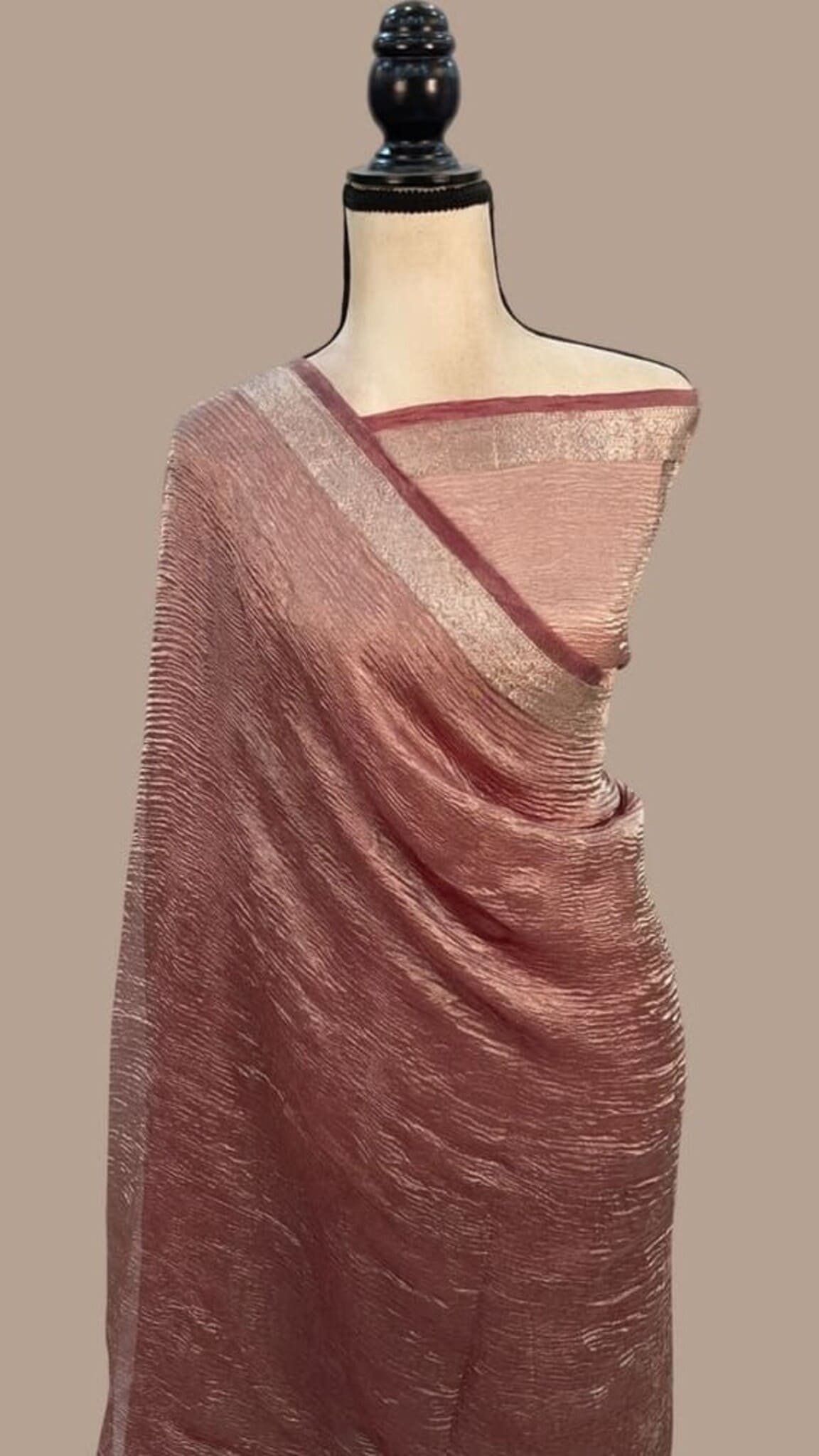 Maroon tissue Banarasi saree with gold pallu border and draped pleats