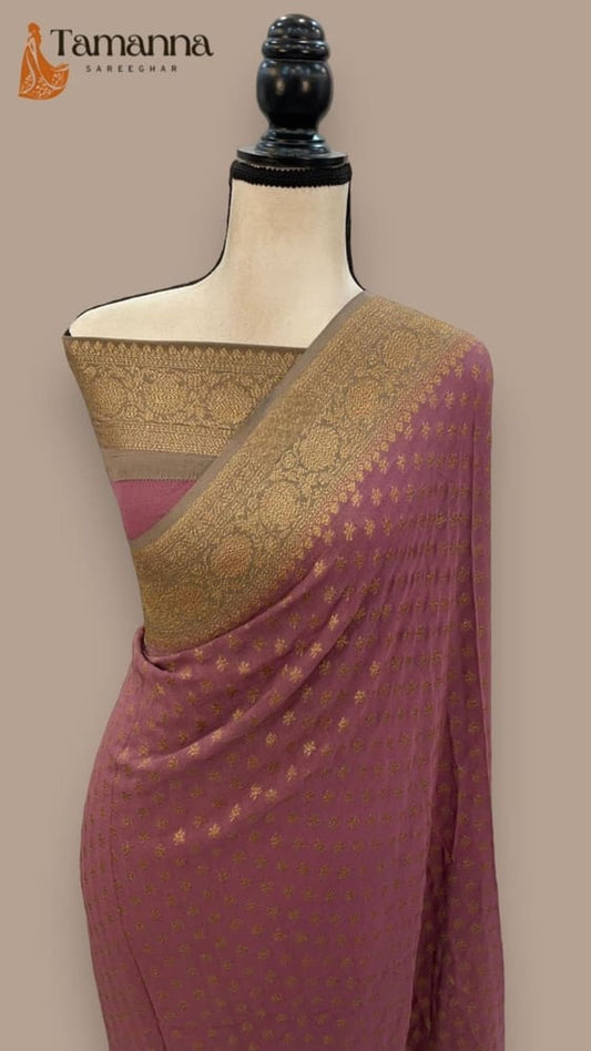 Mauve Banarasi saree with gold zari pallu and woven border across the drape