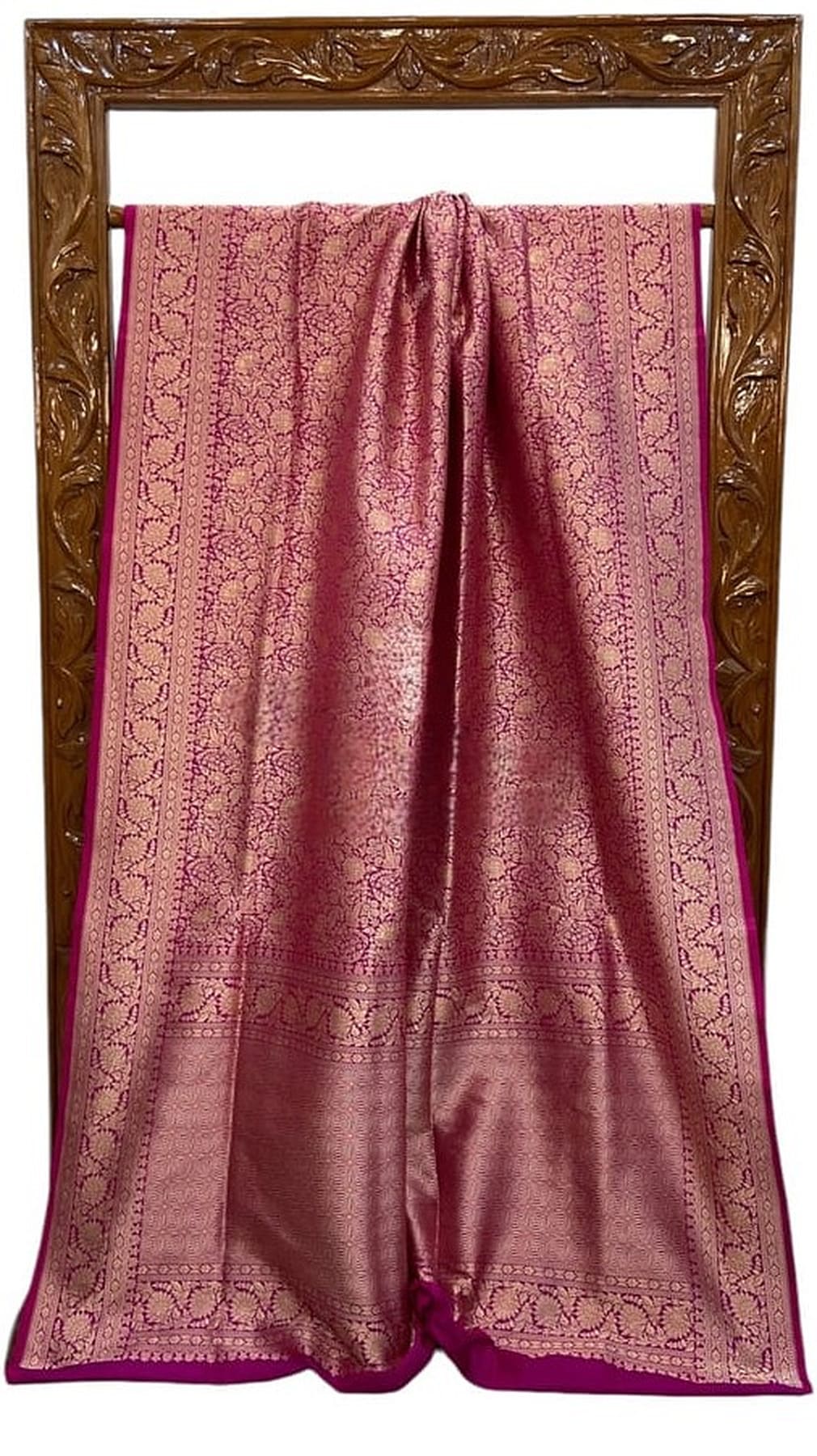 Mauve silk saree with gold brocade edges and gathered pleats, draped flat