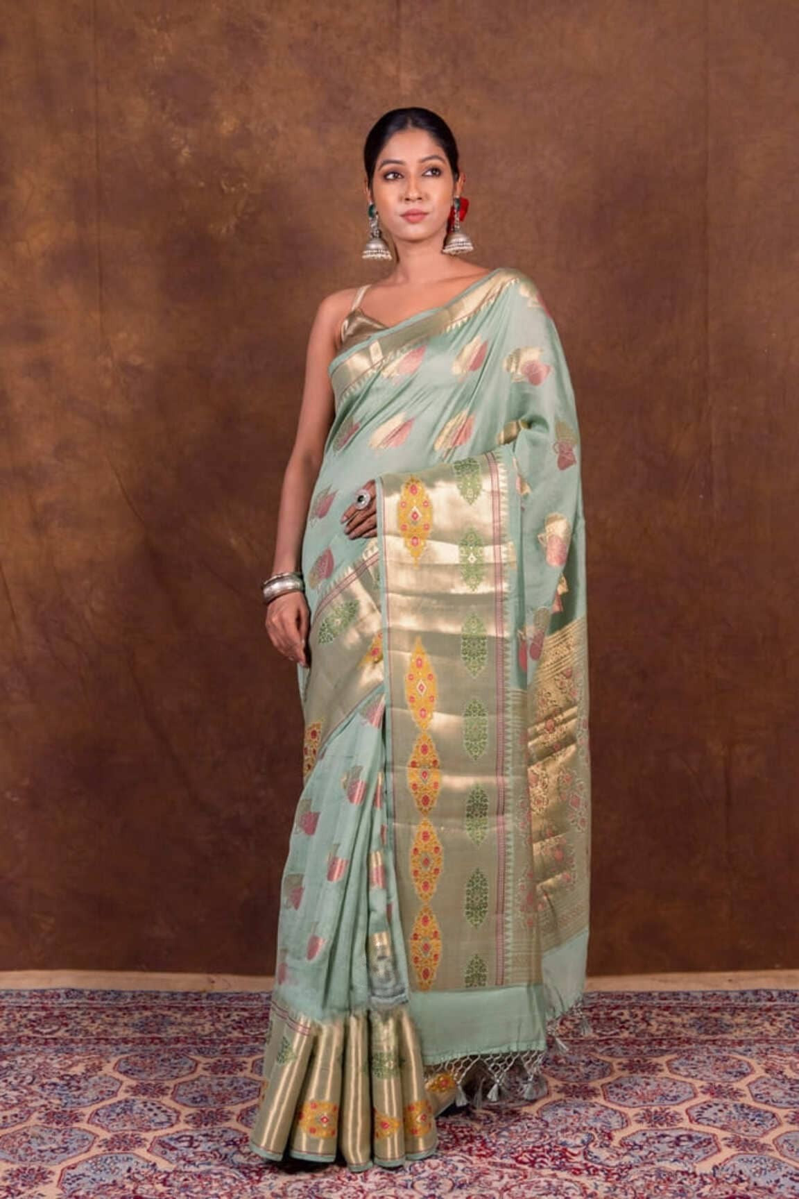 Mint green chanderi Banarasi saree with gold border and colorful tulip motifs