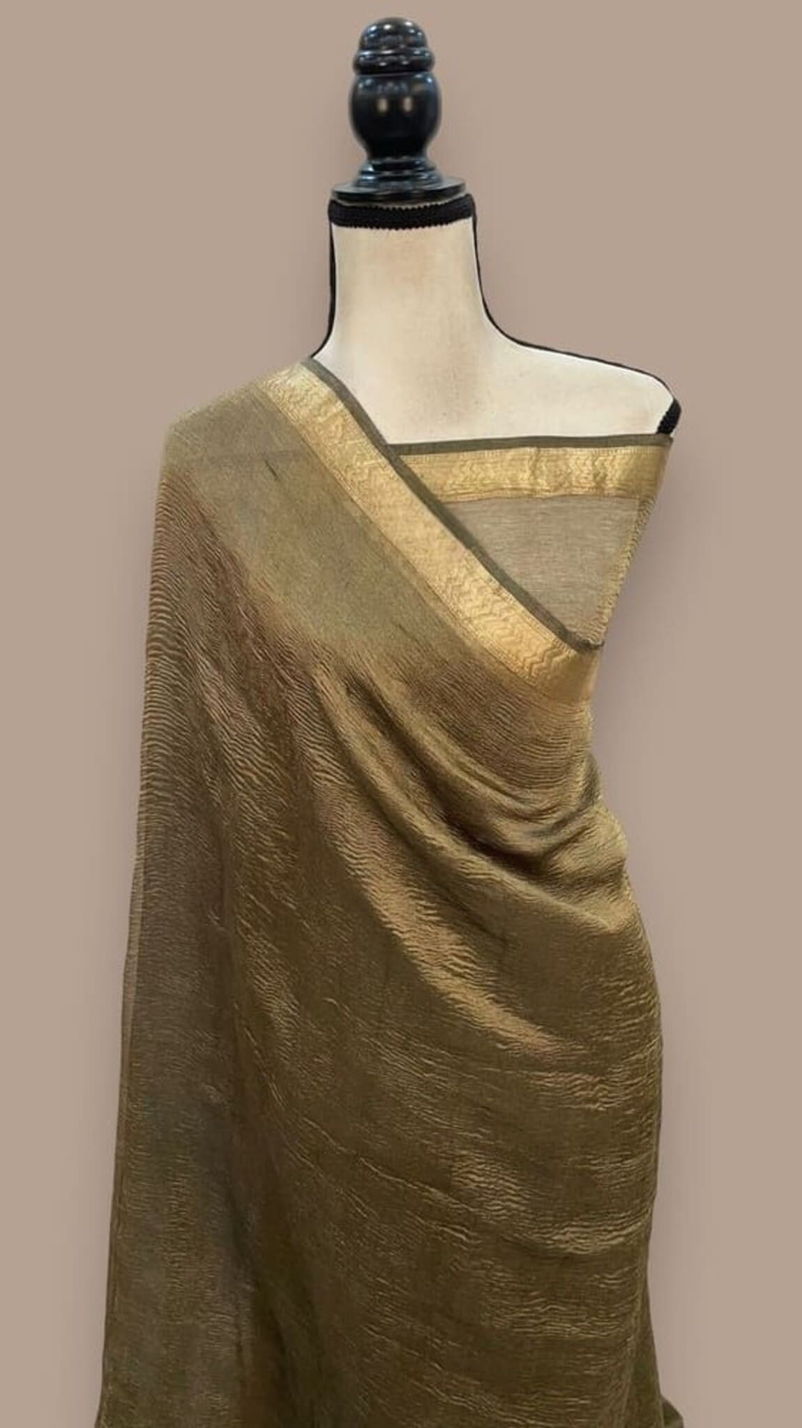 Olive saree with gold tissue border and textured pallu, draped on mannequin