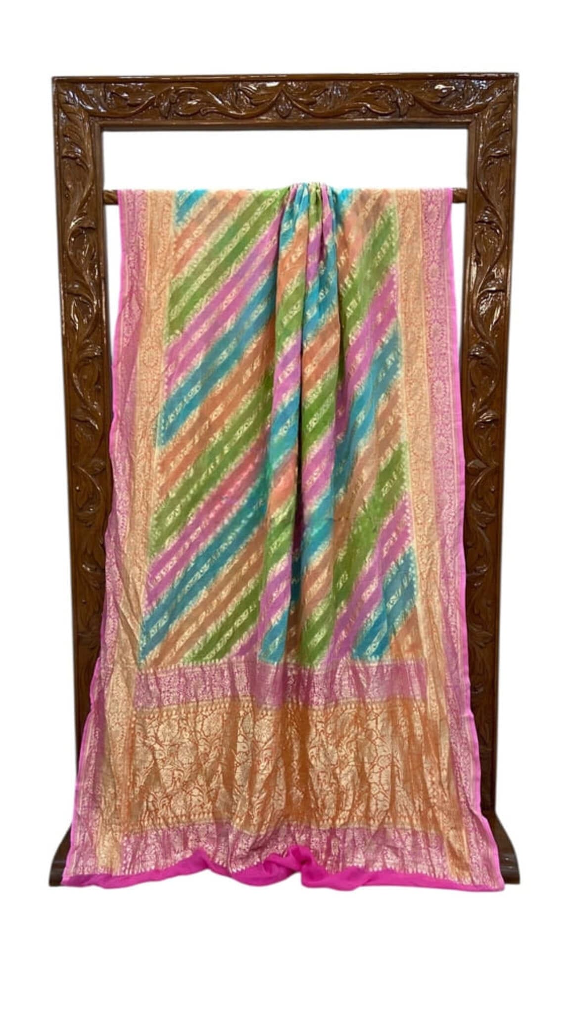 Multicolor saree on stand with magenta edge, diagonal stripes, and gold zari detailing