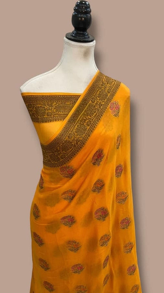 Mustard Banarasi chiffon saree drape, dark gold pallu border with patterned motifs