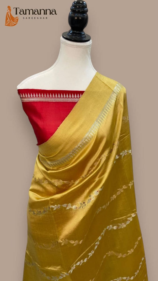 Mustard gold silk saree with red blouse panel and patterned pallu border