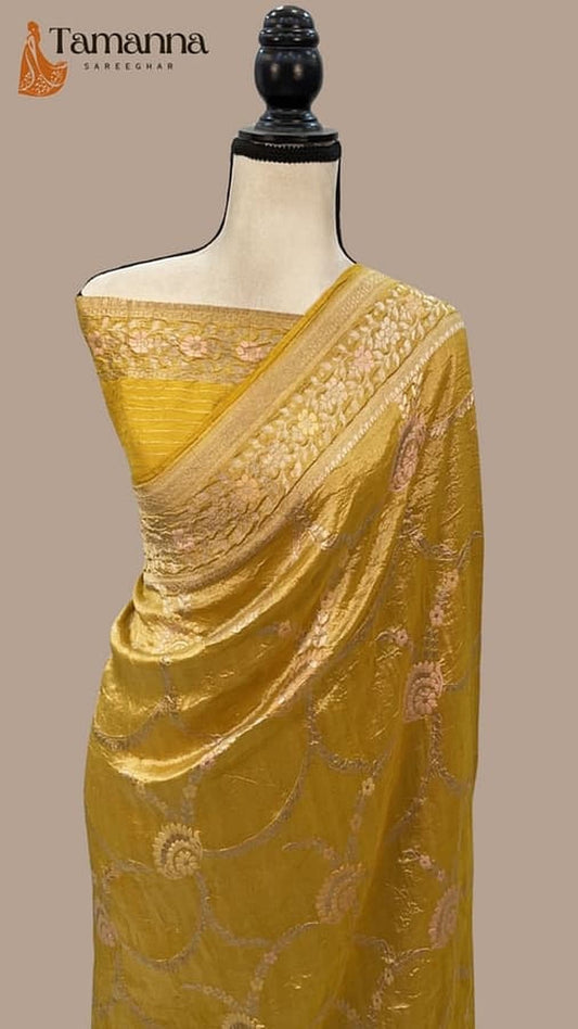 Mustard Banarasi saree with golden zari border and woven pattern on drape
