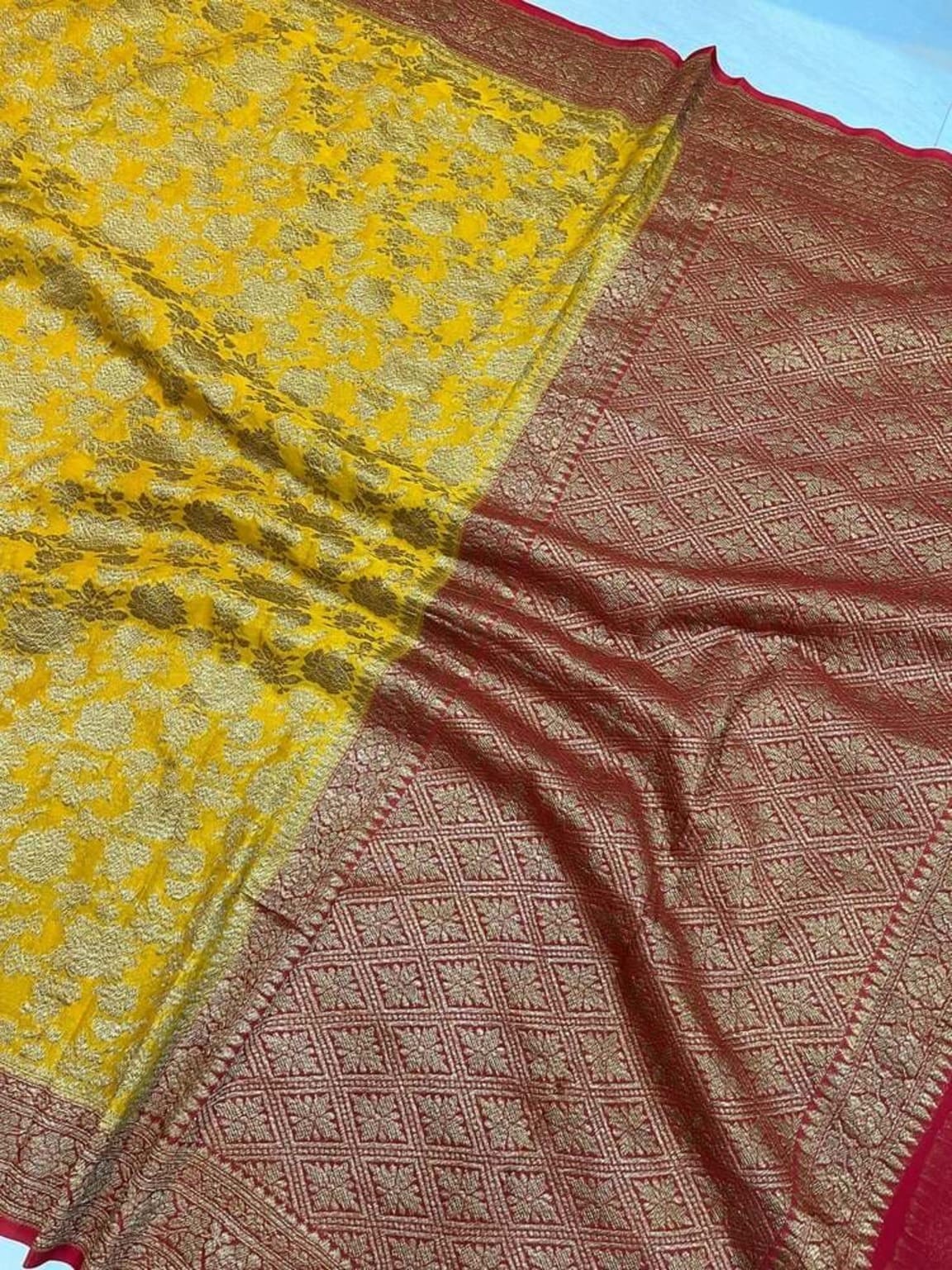 Mustard saree with maroon lattice zari panel and red-gold edge