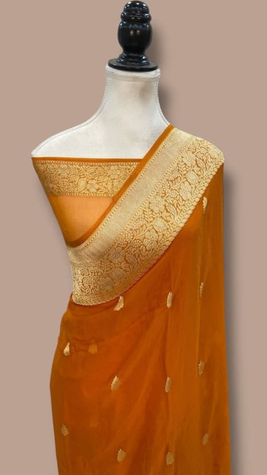 Mustard saree with wide gold zari pallu border and scattered gold motifs
