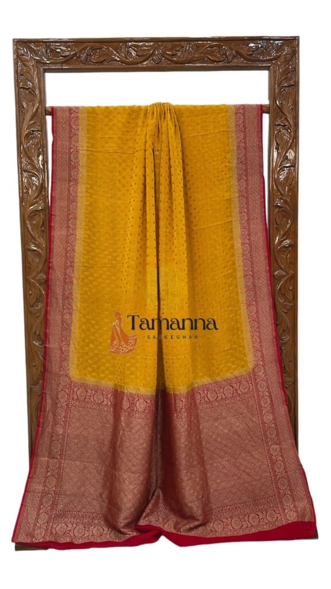 Mustard saree with maroon-red and gold zari border, pleated display, and patterned end