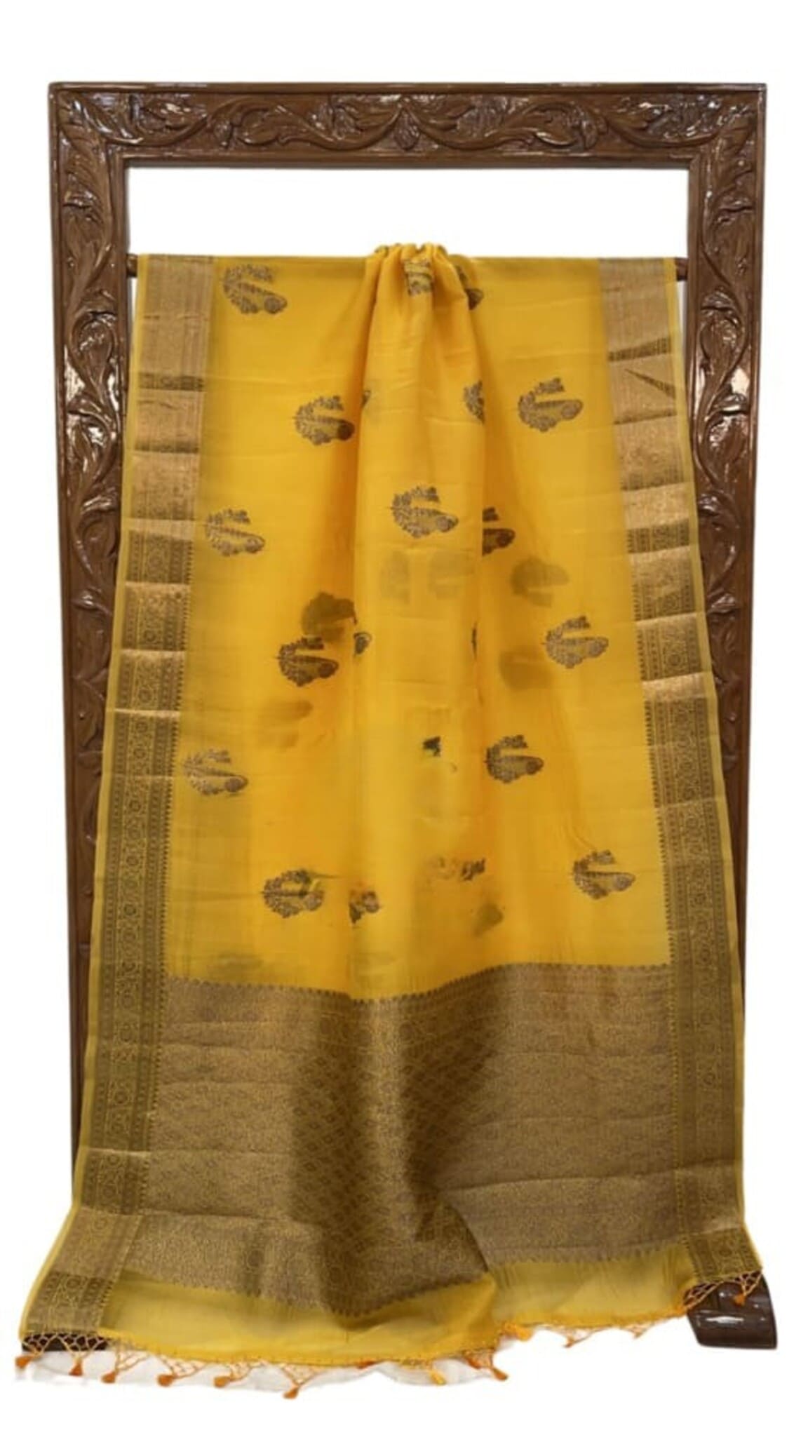 Mustard yellow Banarasi saree with gold border, leaf motifs, and light gray pallu end