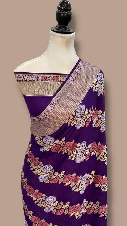 Navy blue saree on mannequin with beige woven pallu border and floral print