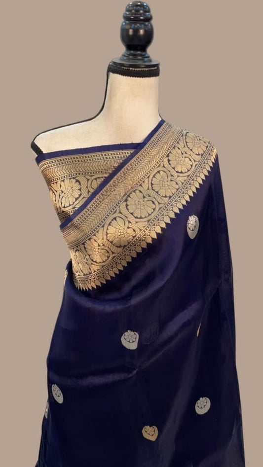 Navy blue Banarasi saree with gold zari pallu and circular motif accents