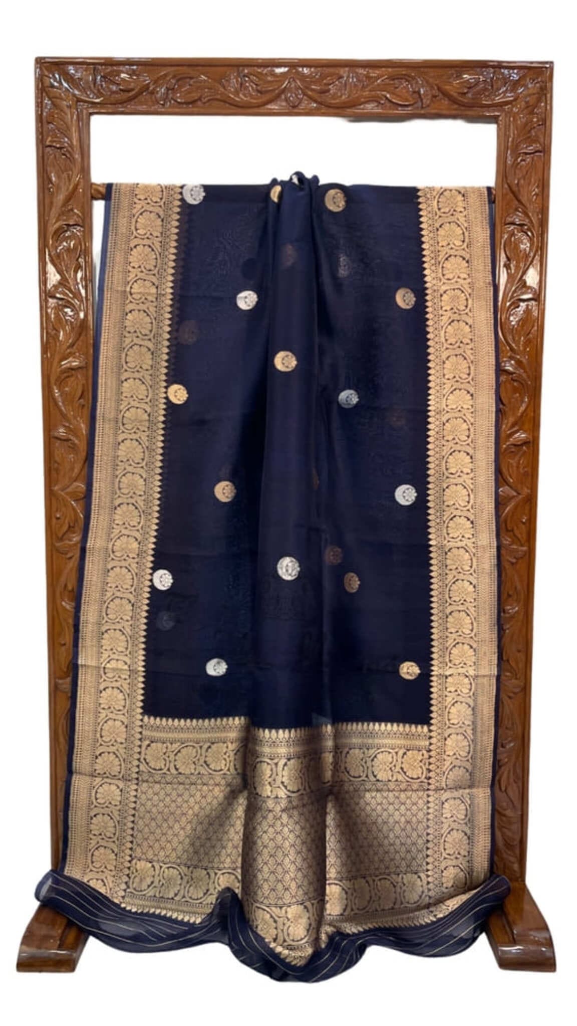 Navy blue Banarasi saree with gold border, coin motifs, and pleated drape
