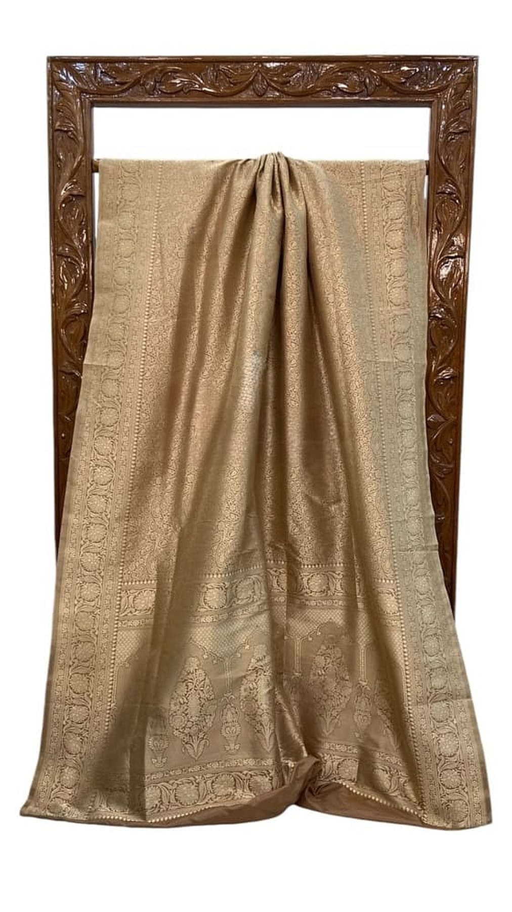 Gold Banarasi silk saree on display with pleated pallu and woven brocade motifs