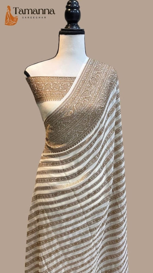 Off-white khaddi georgette saree with gold zari pallu and striped body