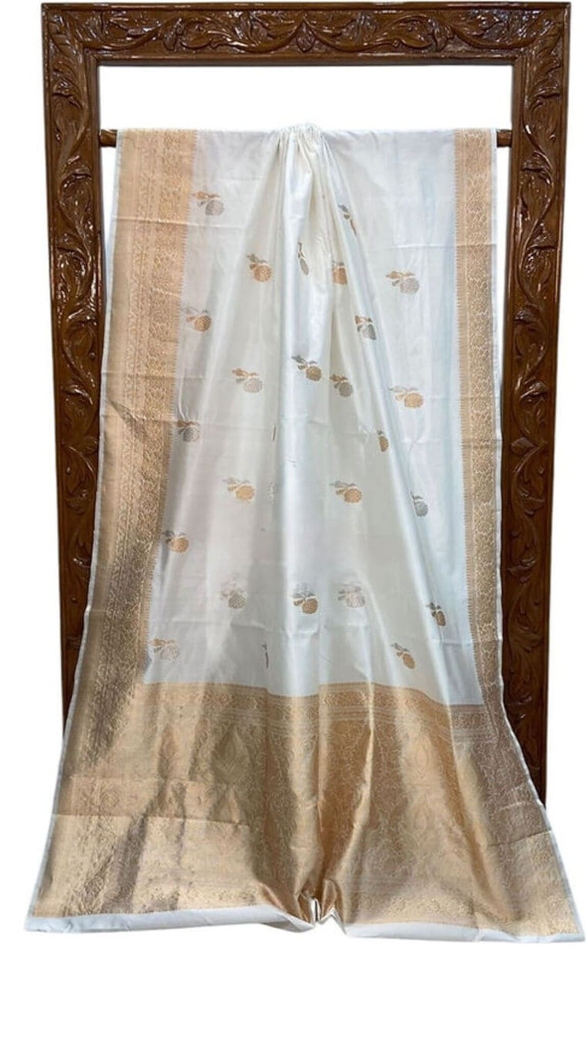 Off-white Banarasi silk saree, framed drape view with gold-toned border and motifs