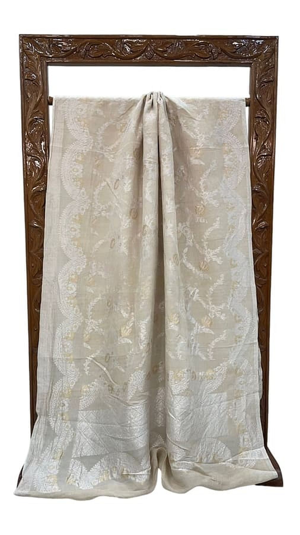 Off-white Banarasi georgette handloom saree, folded fabric with allover zari pattern