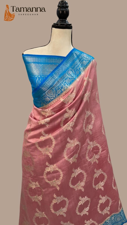 Pink silk saree with blue pallu border and gold floral vine motifs