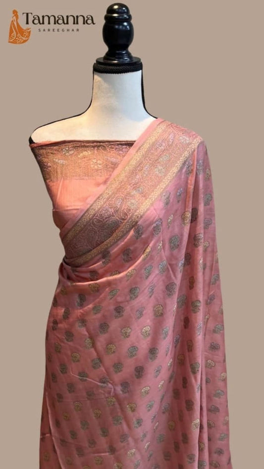Pink Banarasi saree with gold motifs and wide zari border, pallu on mannequin
