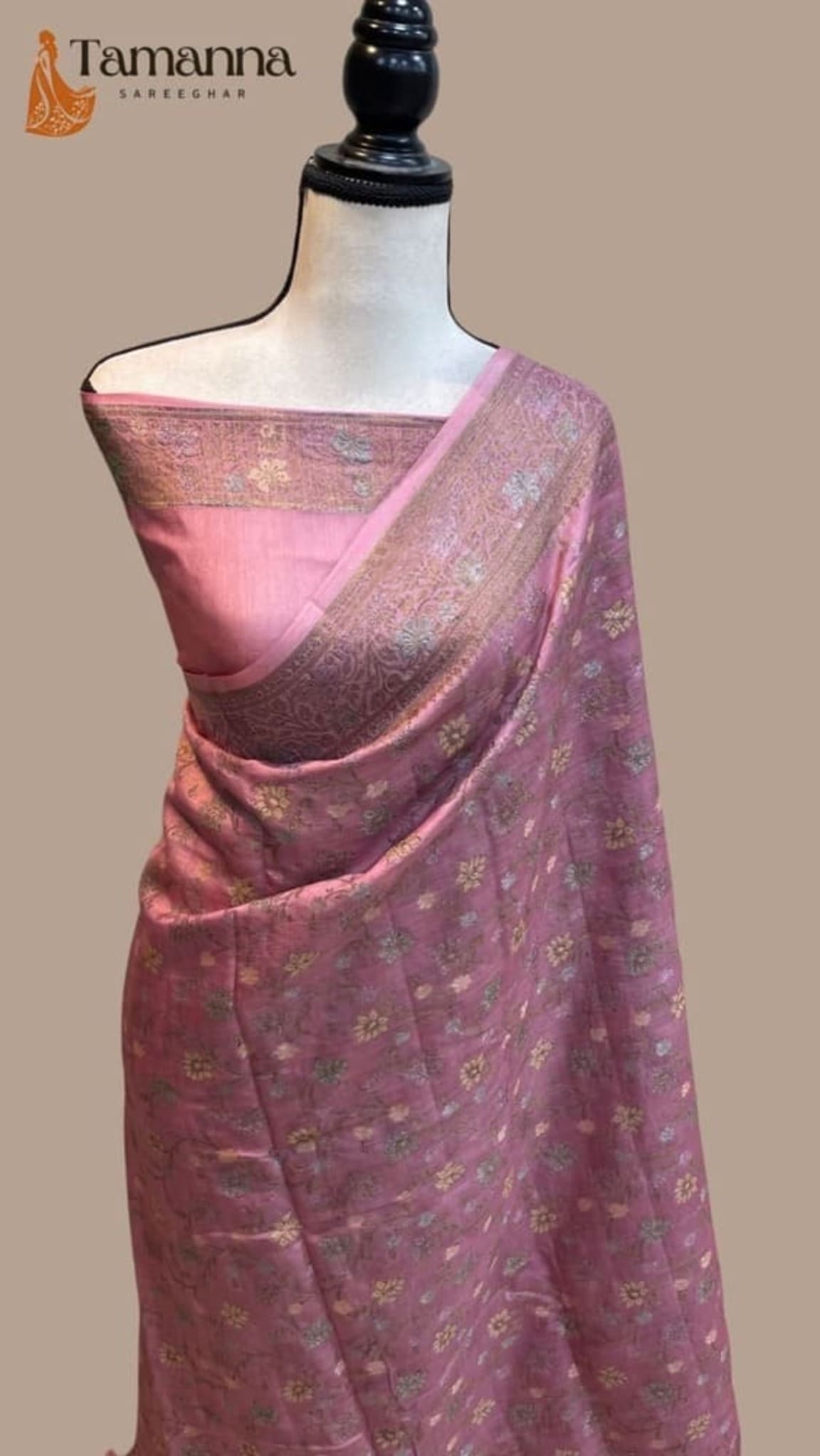 Pink Banarasi-style crepe saree with gold zari border and allover small floral motifs
