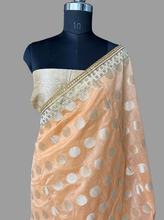 Pink silk saree with diagonal gold border and scattered white dots