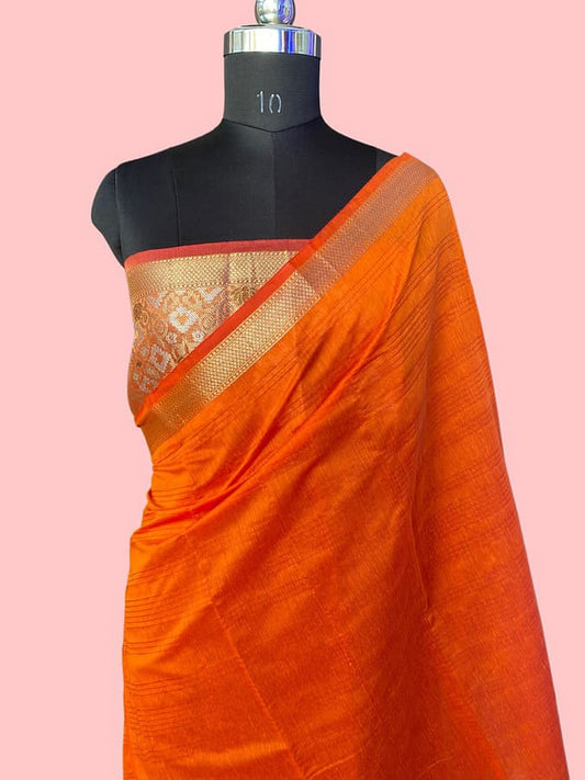 Orange pure silk saree with patterned beige-gold border, draped on mannequin