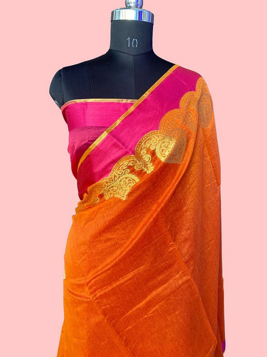 Orange pure silk saree with gold-patterned pallu and magenta border, draped