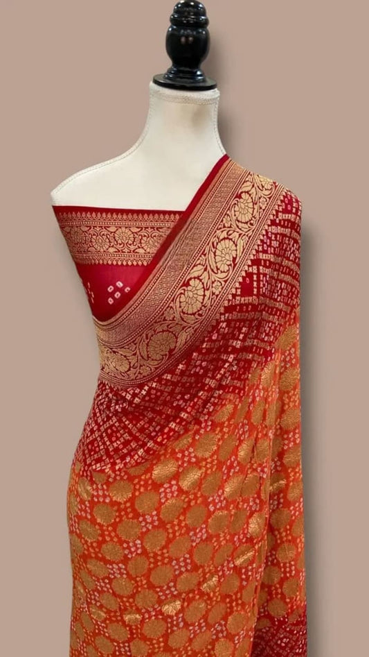 Draped saree on mannequin: maroon pallu with mustard body, gold woven bandhej border