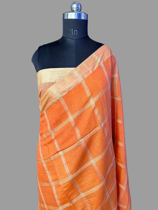 Orange silk saree with gold-toned border and white grid stripes, draped on mannequin