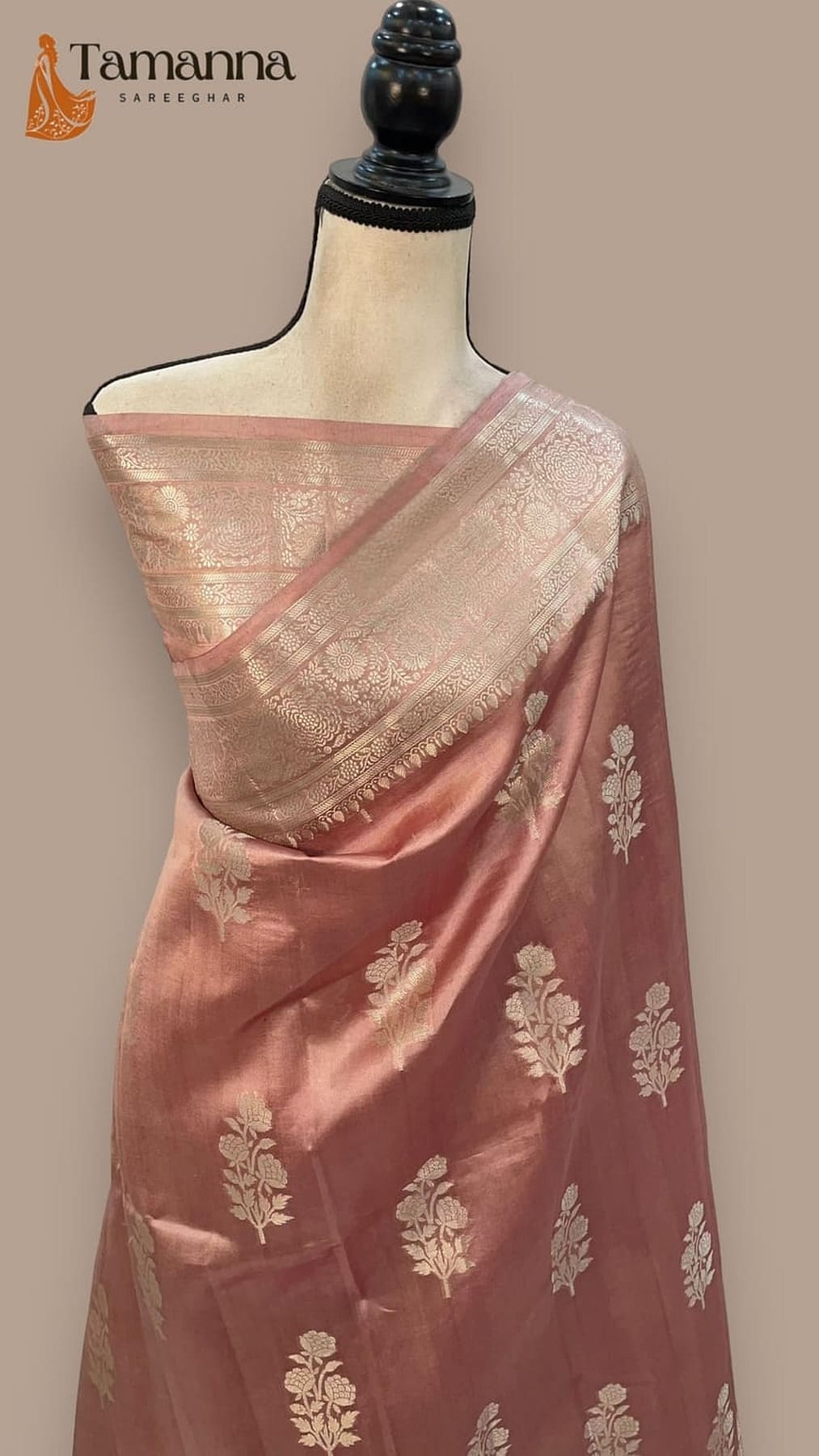 Pastel pink silk saree with gold-toned butta motifs and shimmering pallu
