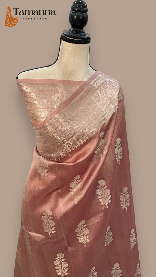 Mannequin draped pastel pink silk saree with gold butta motifs