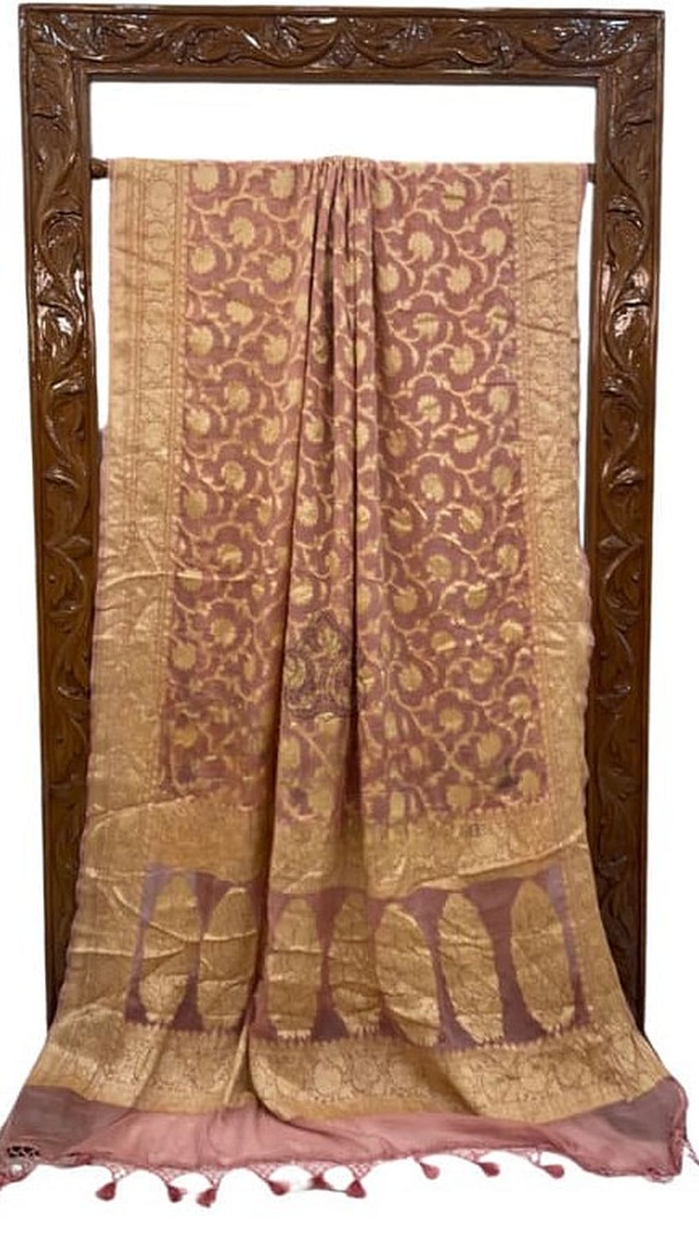 Peach pink Banarasi saree pleated display with gold zari border and tassel fringe