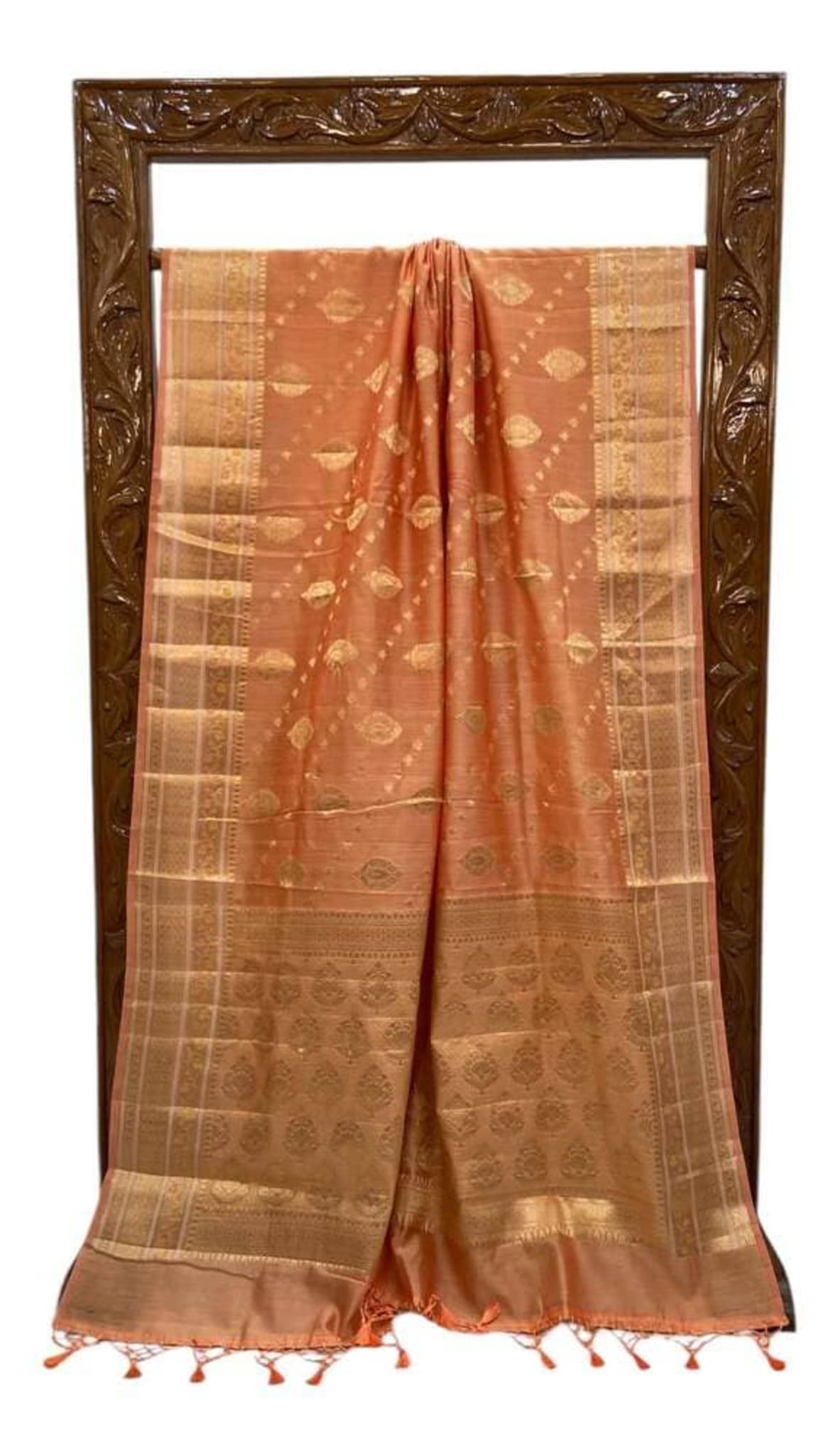 Peach cotton handloom Banarasi saree hanging with gold border and tassel trim