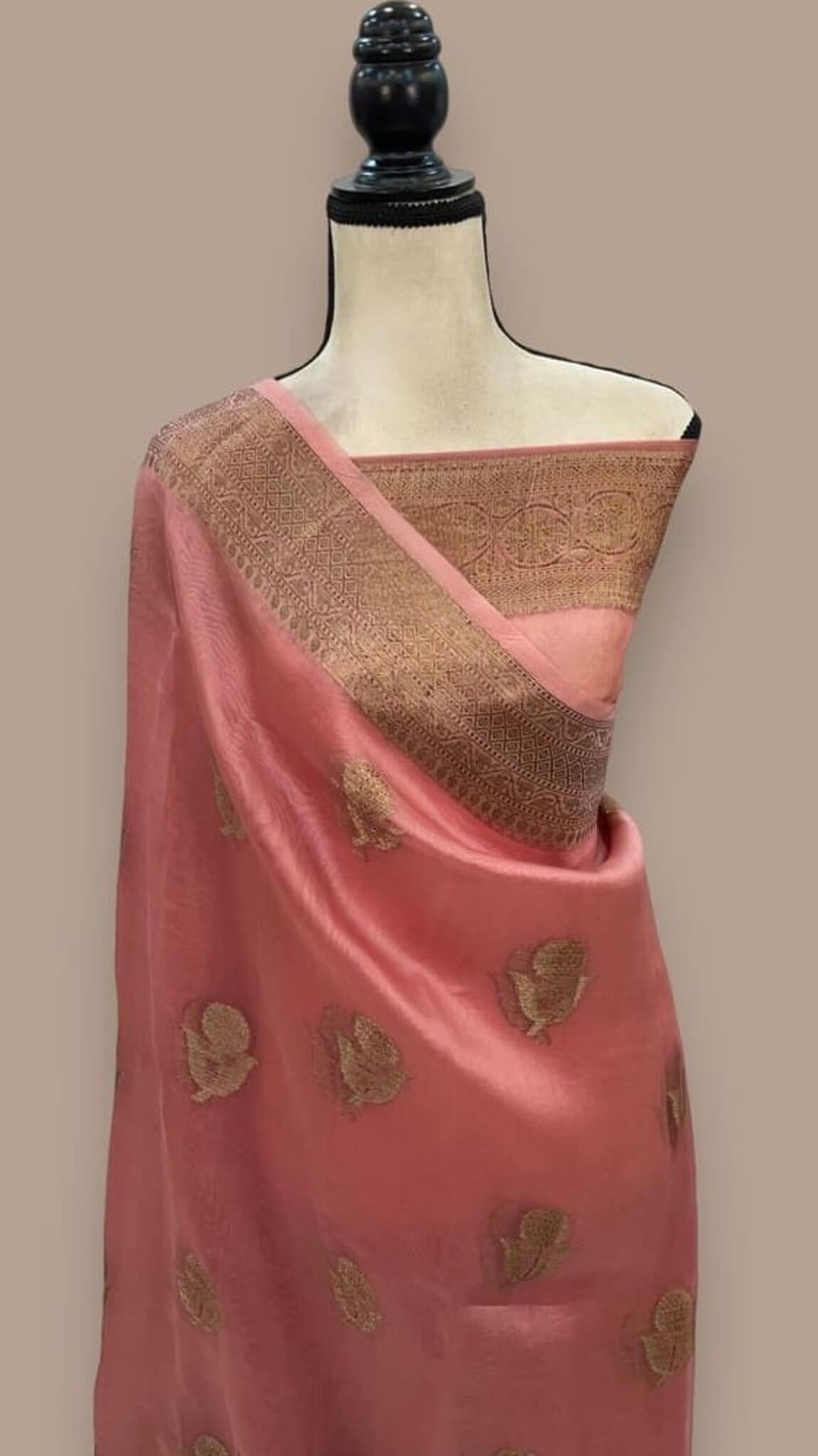 Peach Banarasi handloom saree with wide gold border and scattered leaf motifs, draped