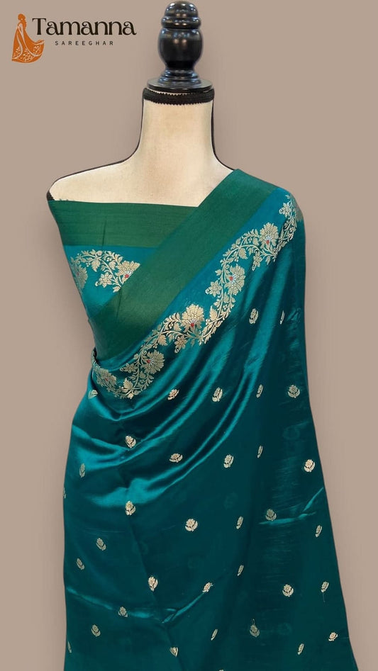 Teal silk saree with gold zari motifs and floral banarasi pallu border