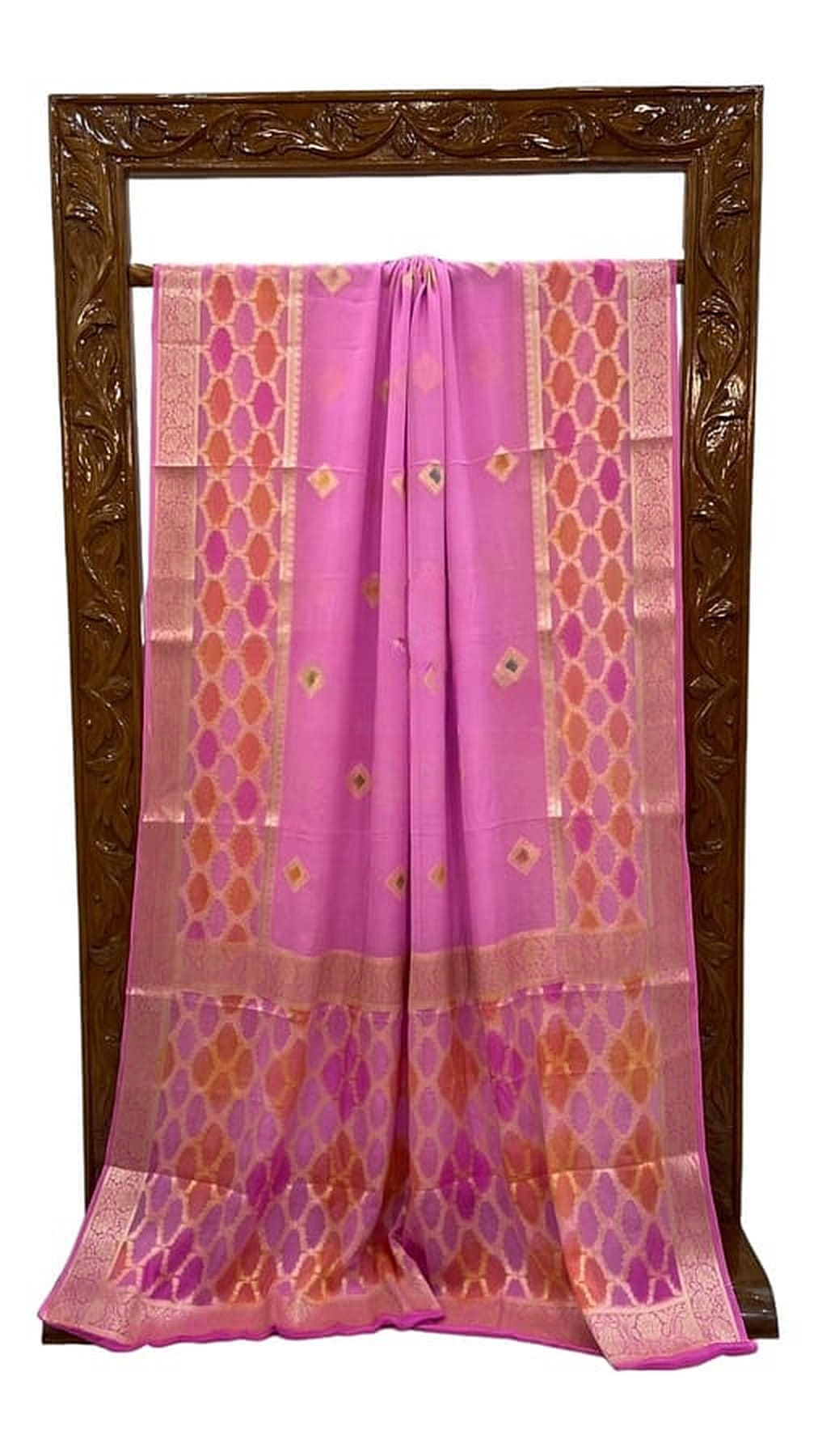 Pink chiffon saree displayed with gold border, diamond motifs, and pleated body