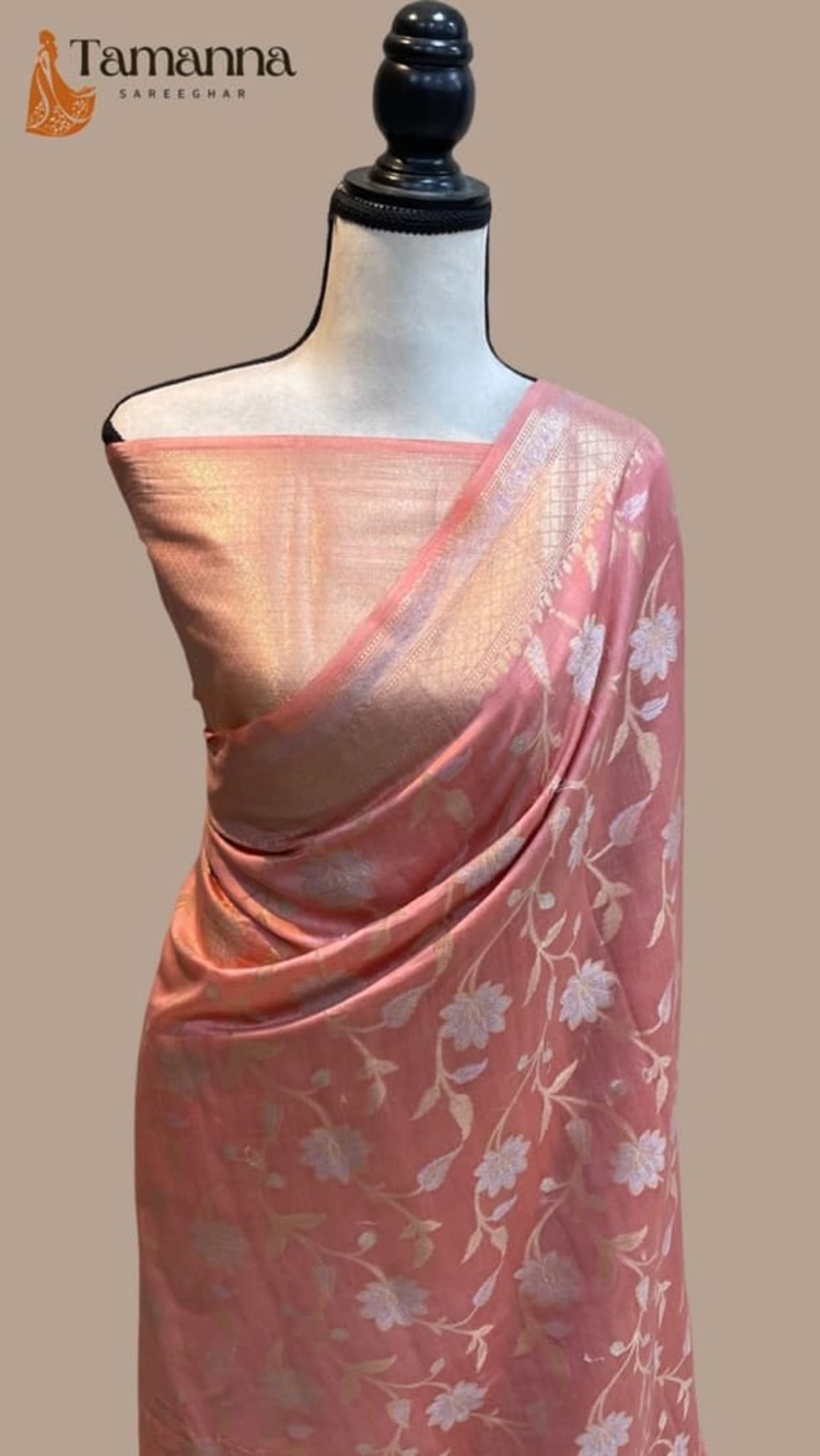 Pink handloom Banarasi saree drape with gold zari edge and white floral motifs