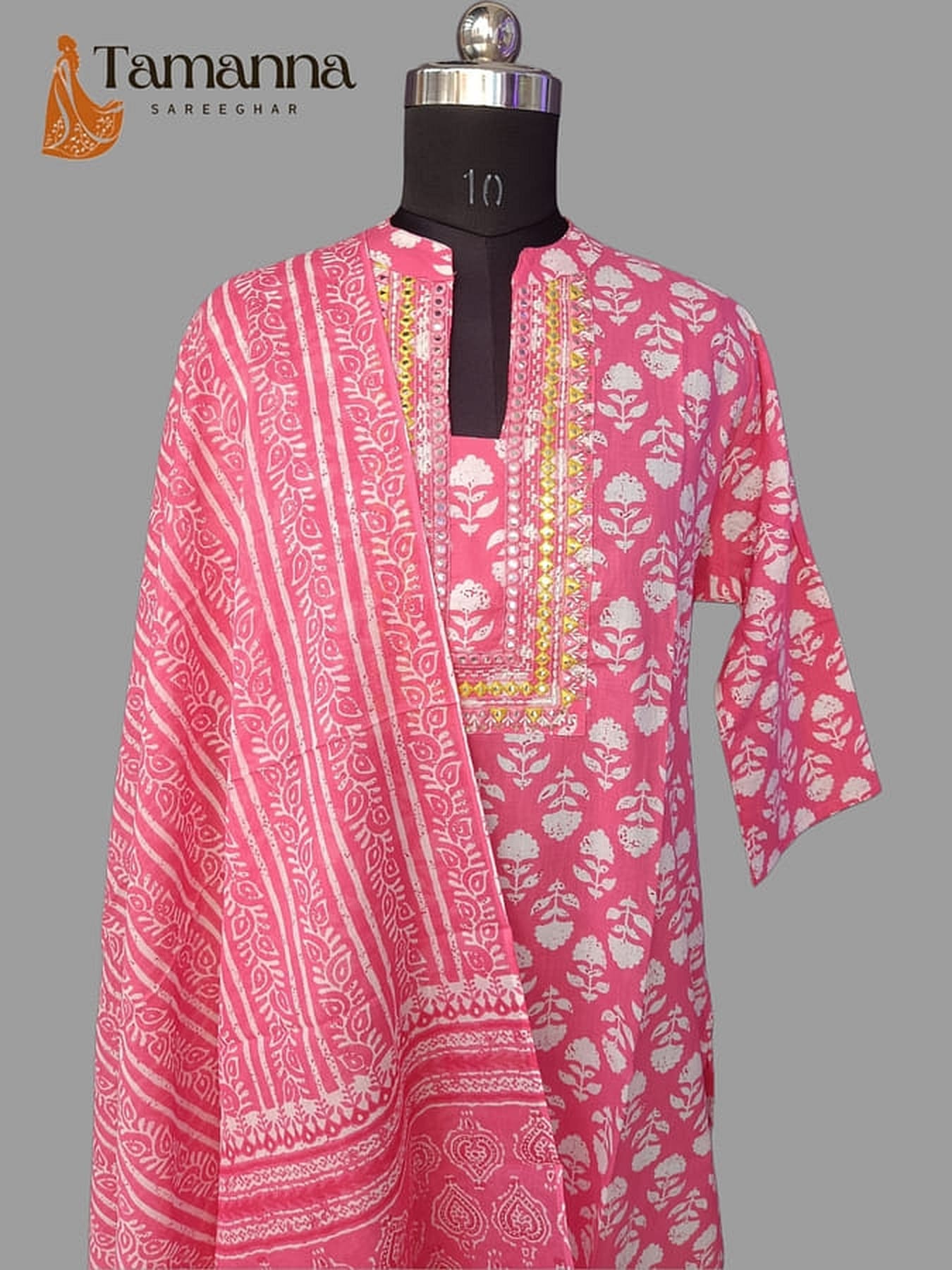 Pink printed cotton suit set, front view of V-neck kurta with decorative yoke