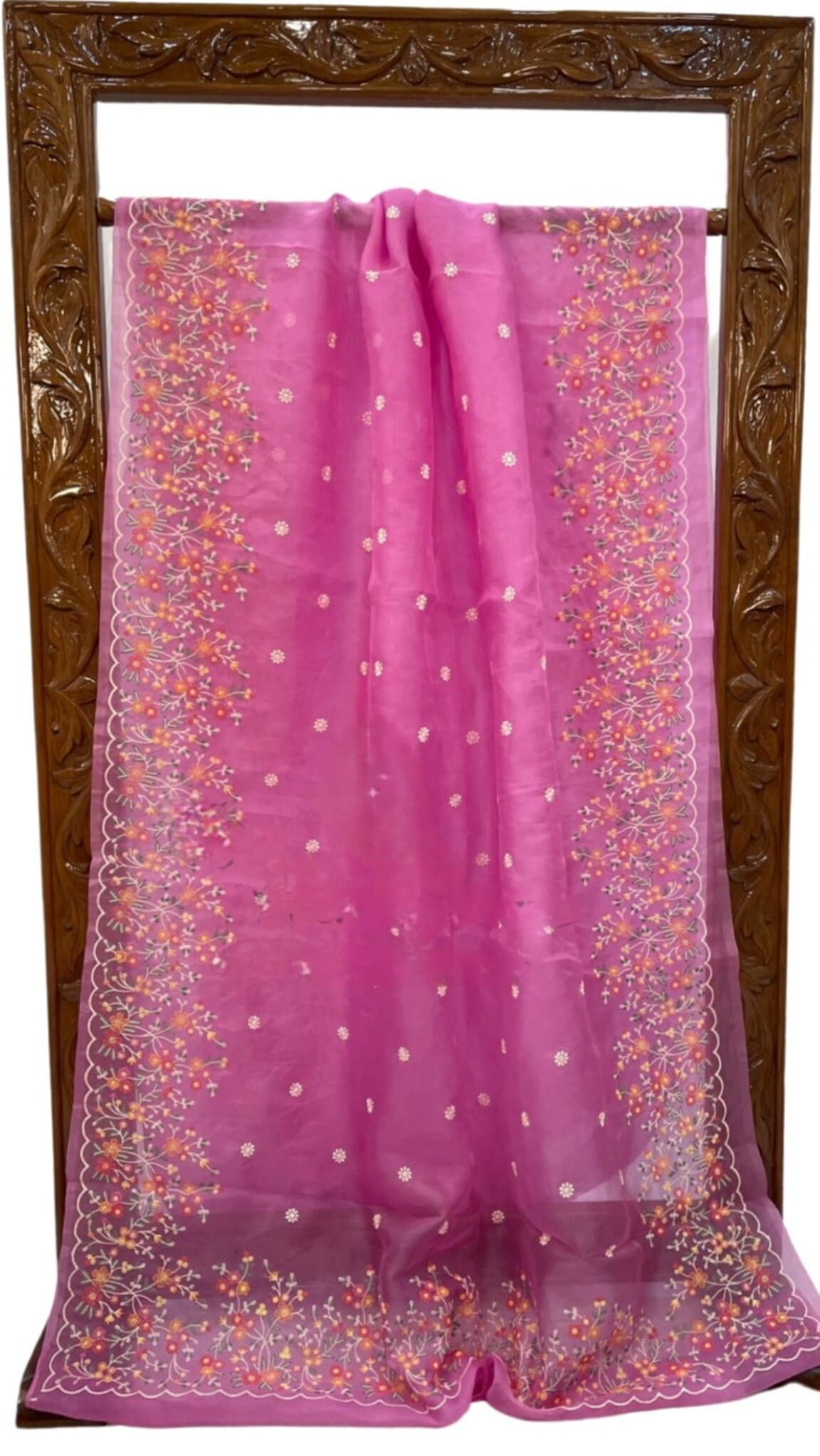 Pink organza saree, full view with embroidered center and decorated border edging