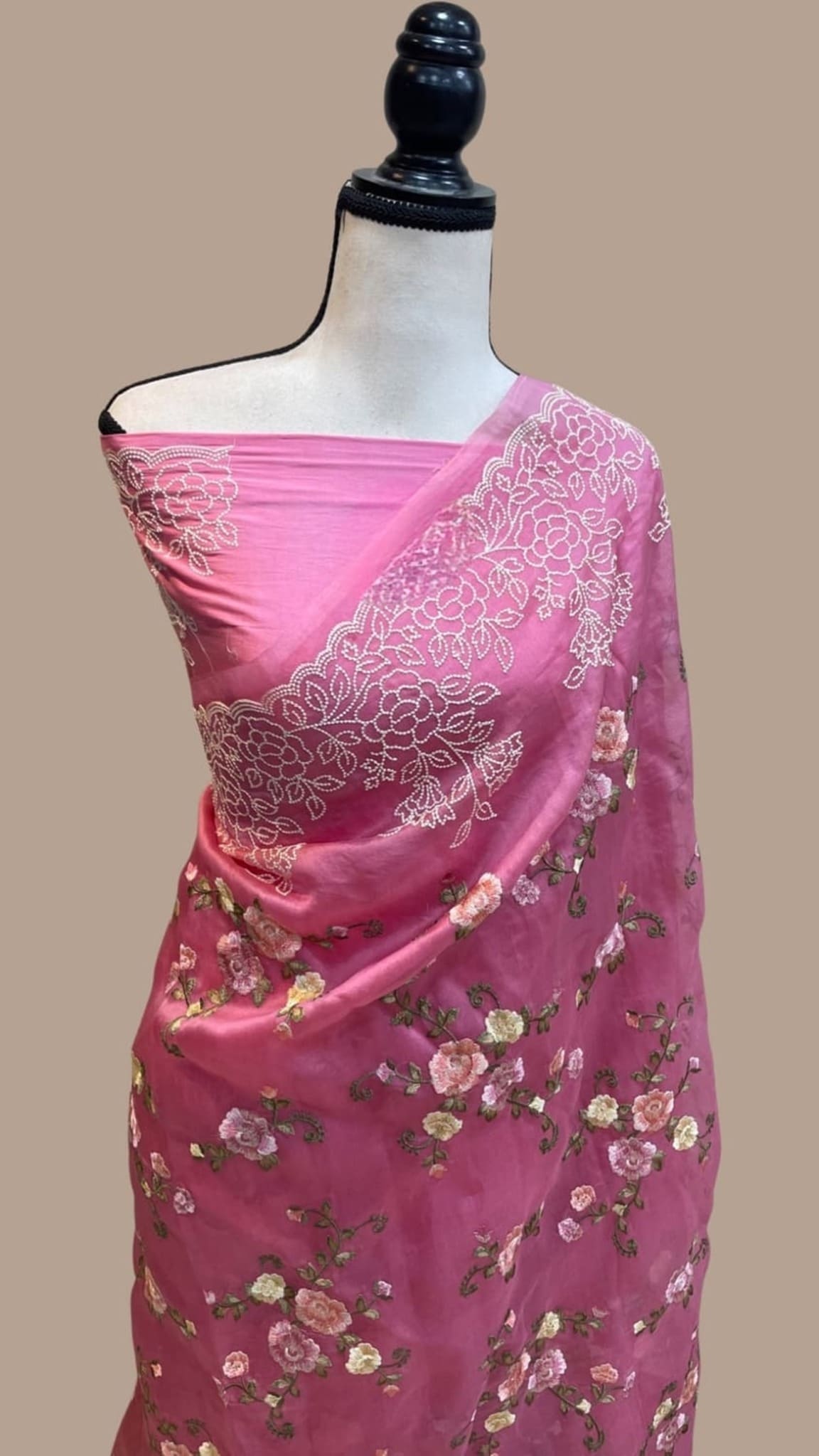 Pink organza Banarasi saree with floral chikankari embroidery and wide zari edge
