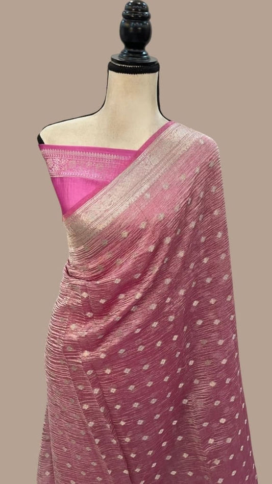 Pink Banarasi tissue saree with gold border and scattered motifs, draped on mannequin