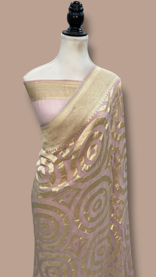 Banarasi saree pallu with gold border, light lavender base, and large circular zari designs