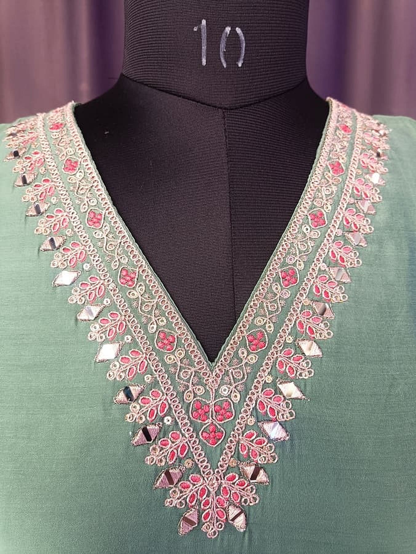 Embroidered lace V-neck yoke with pink floral motifs on mint green kurta