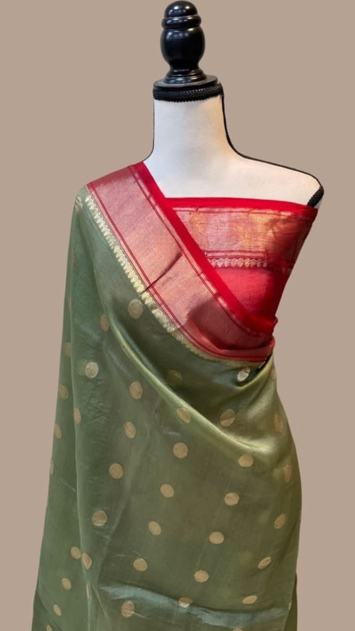 Olive green saree with gold polka dots and red pallu with woven border