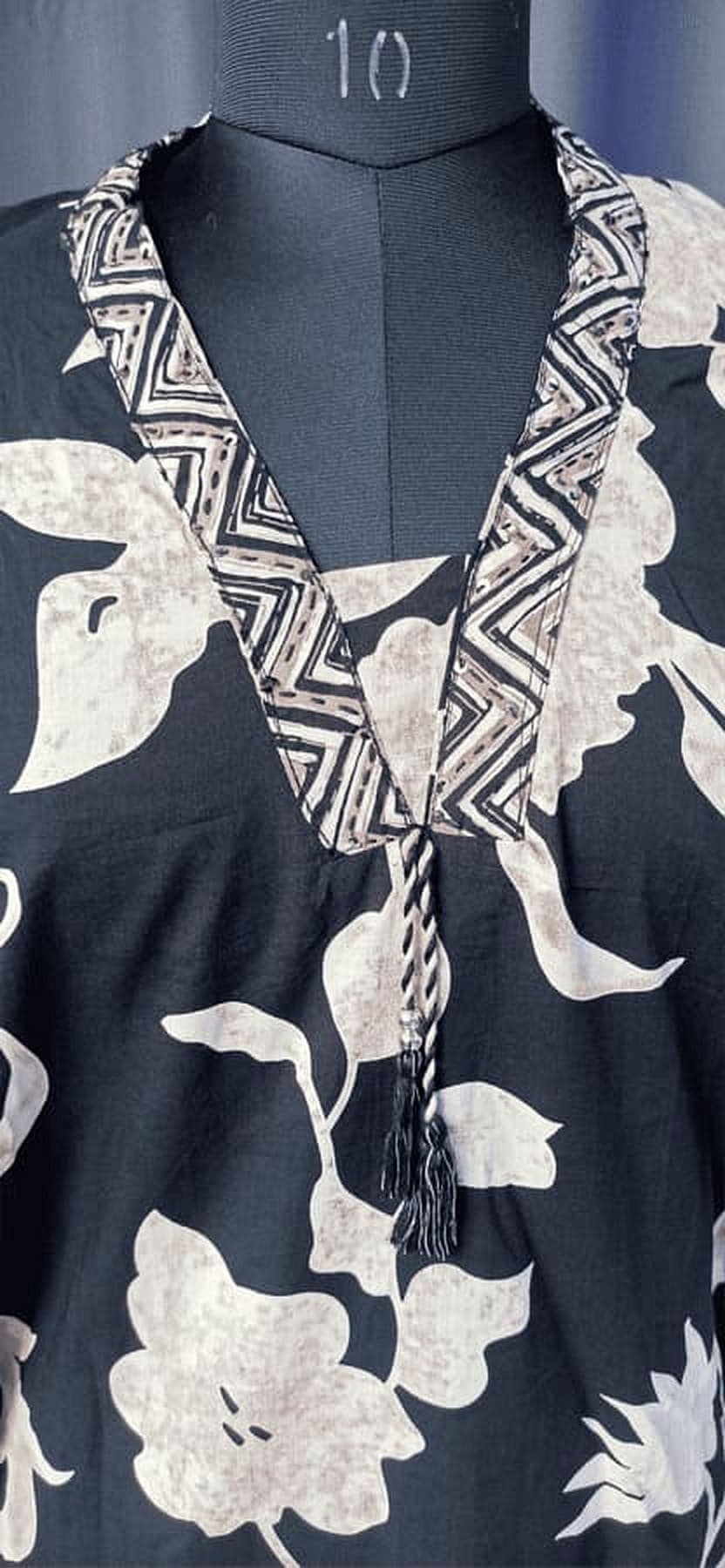 Cotton suit set kurta close-up detail: black with white floral print V-neck border