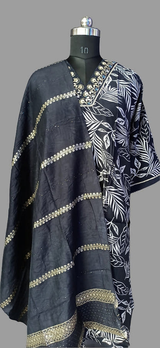 Navy silk kurta set side view with gold diagonal border and white leaf print panel