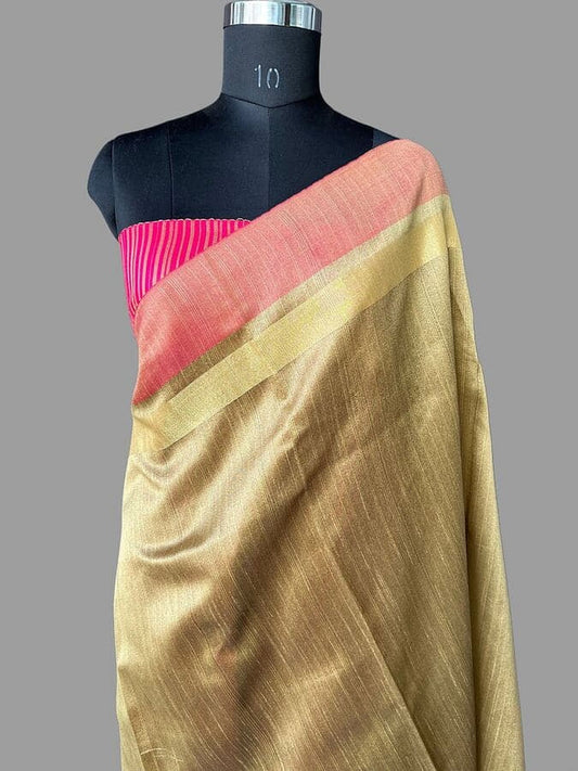 Gold silk saree with coral pallu and magenta striped edge on mannequin