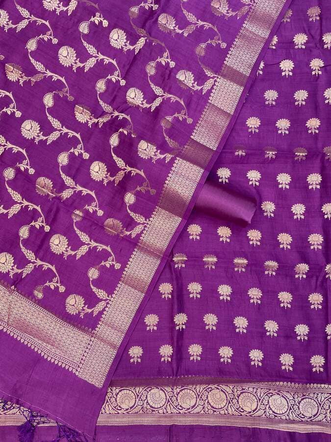 Purple silk fabric close-up with gold brocade border and repeating small floral dot pattern