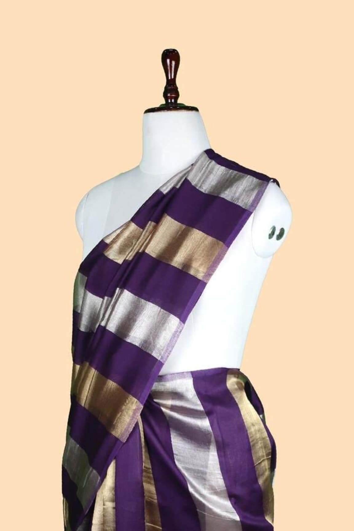 Purple tissue saree with metallic silver and gold stripes on mannequin torso