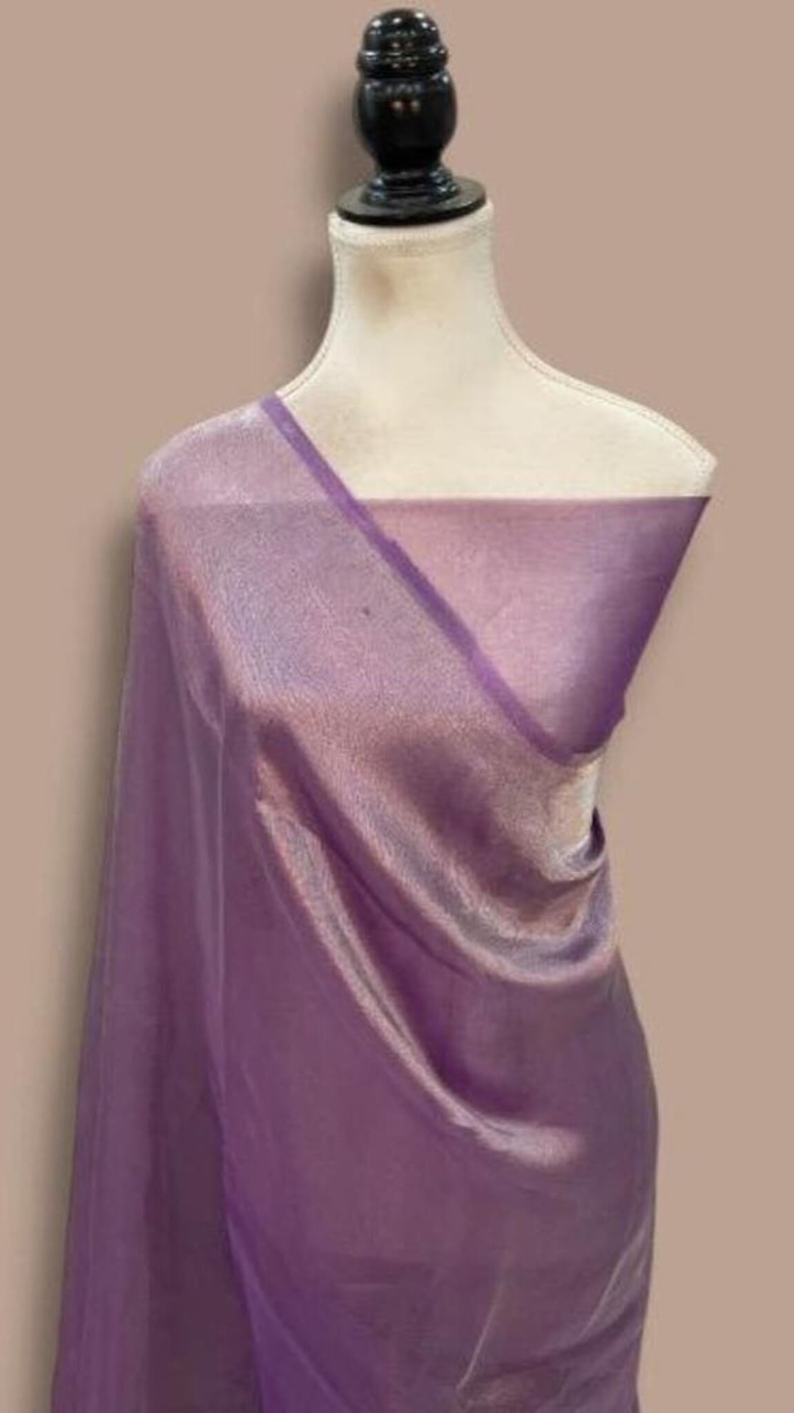 Purple Banarasi saree on mannequin, cream blouse, diagonal purple pallu border